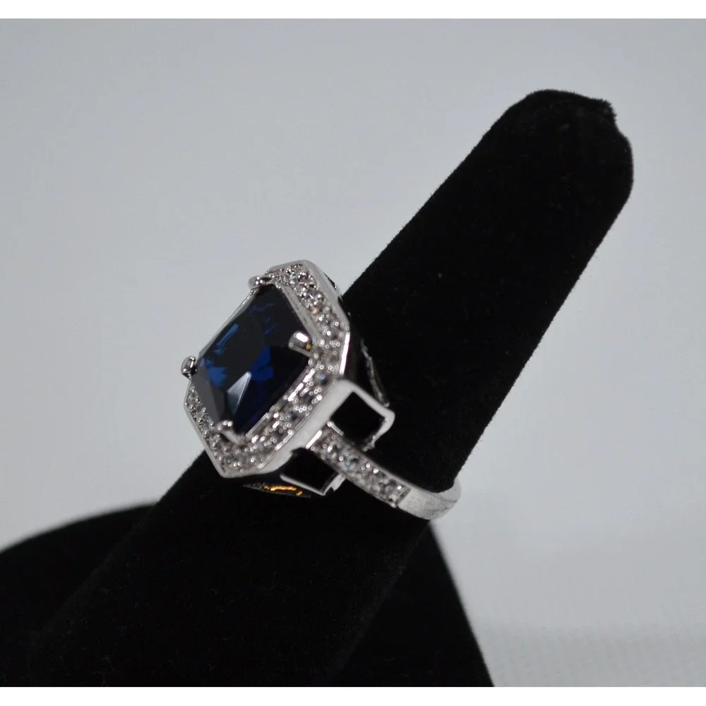 Silver Tone Ring Sz 6.75 w/ Large Blue Setting Sounded By Tiny Clear Rhinestones
